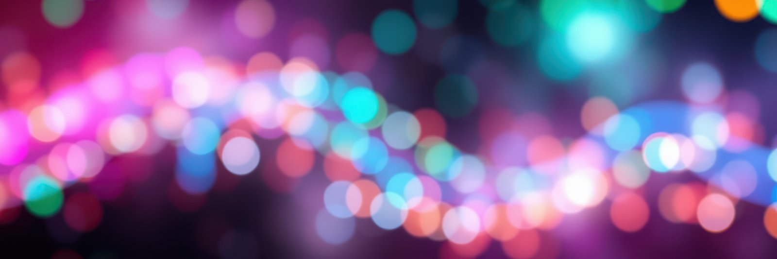 Colorful abstract lights create a festive atmosphere in a vibrant celebration at night